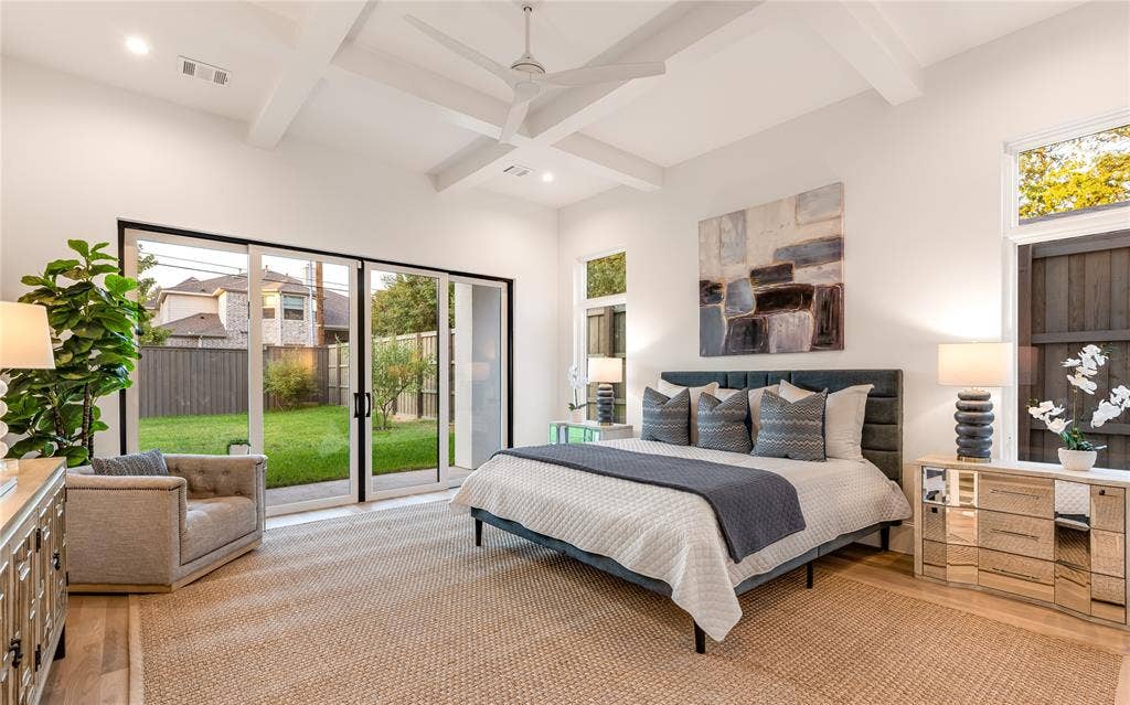 Vaulted ceiling with exposed beams, recessed lighting, and a ceiling fan