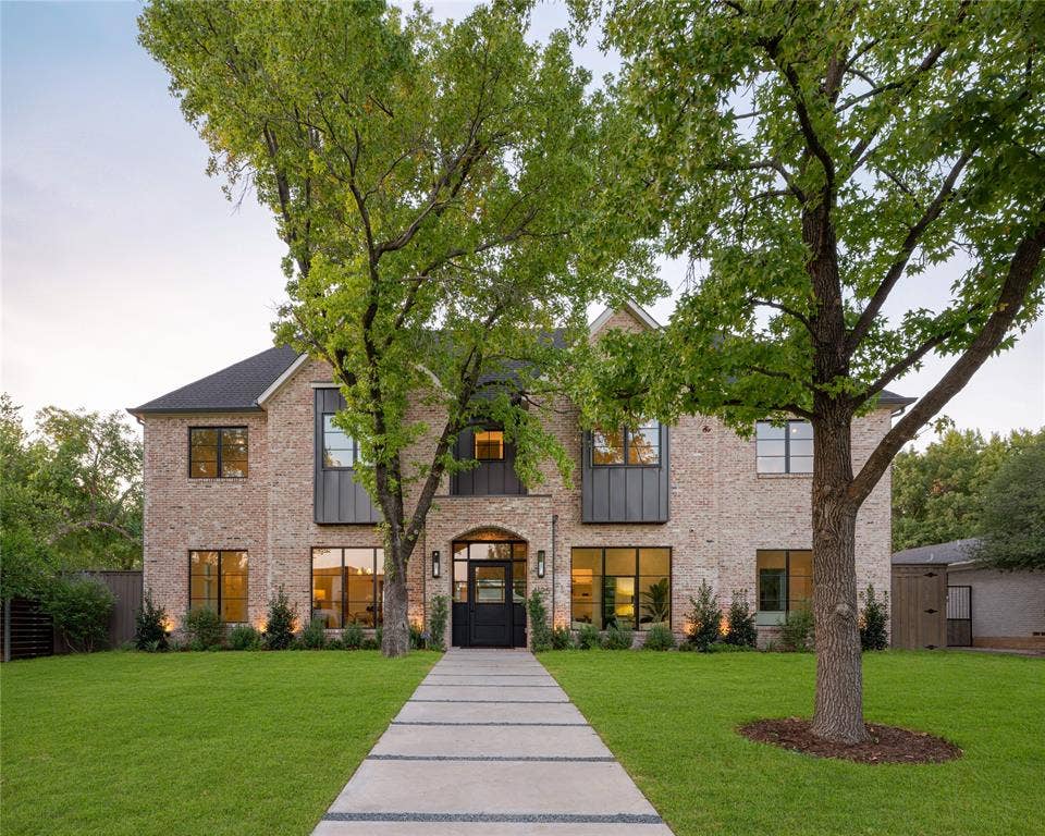 Brick facade with dark metal accents and a dark roof