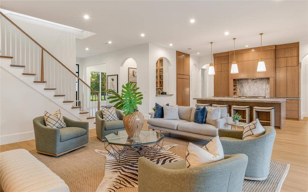 Open-concept living space with light wood-finish flooring