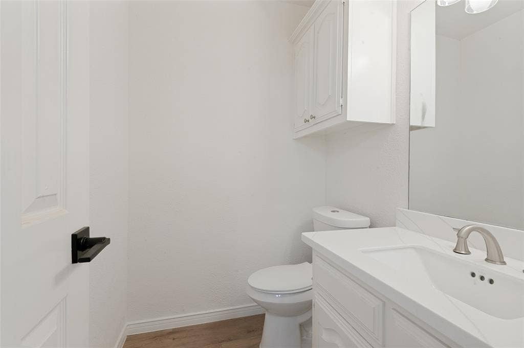 White paneled door with a matte black lever handle