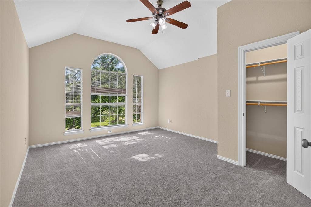 7112 Chandler Drive, Plano, TX 75024 Vaulted ceiling with an installed ceiling fan and light fixture