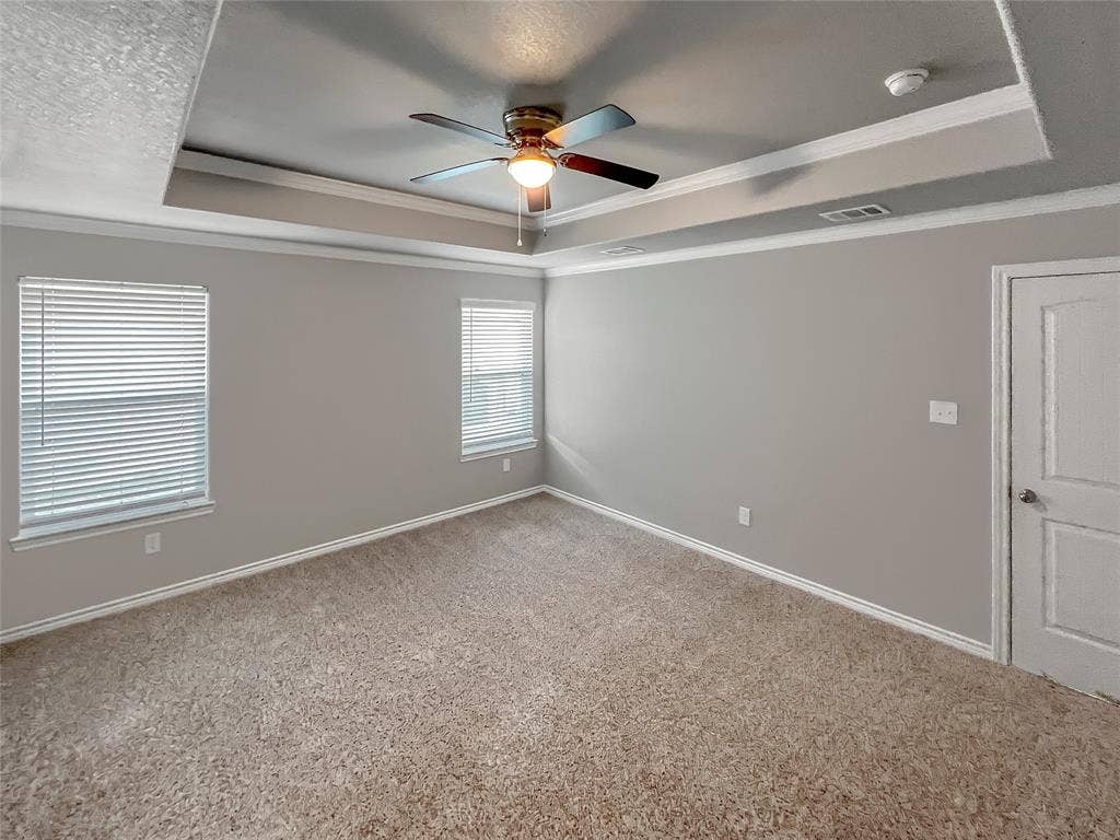 1210 Campbelton Drive, Temple, TX 76504 Tray ceiling with decorative crown molding and a ceiling fan light fixture