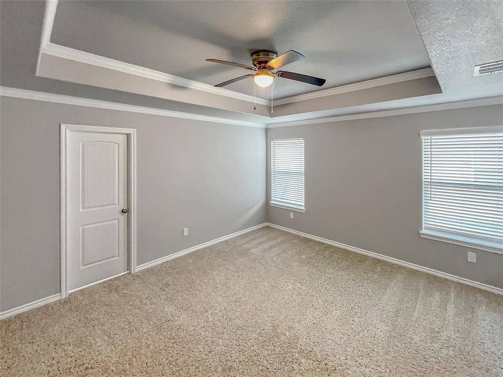 1210 Campbelton Drive, Temple, TX 76504 Recessed ceiling with crown molding and a ceiling fan, neutral carpet flooring, and two windows with blinds
