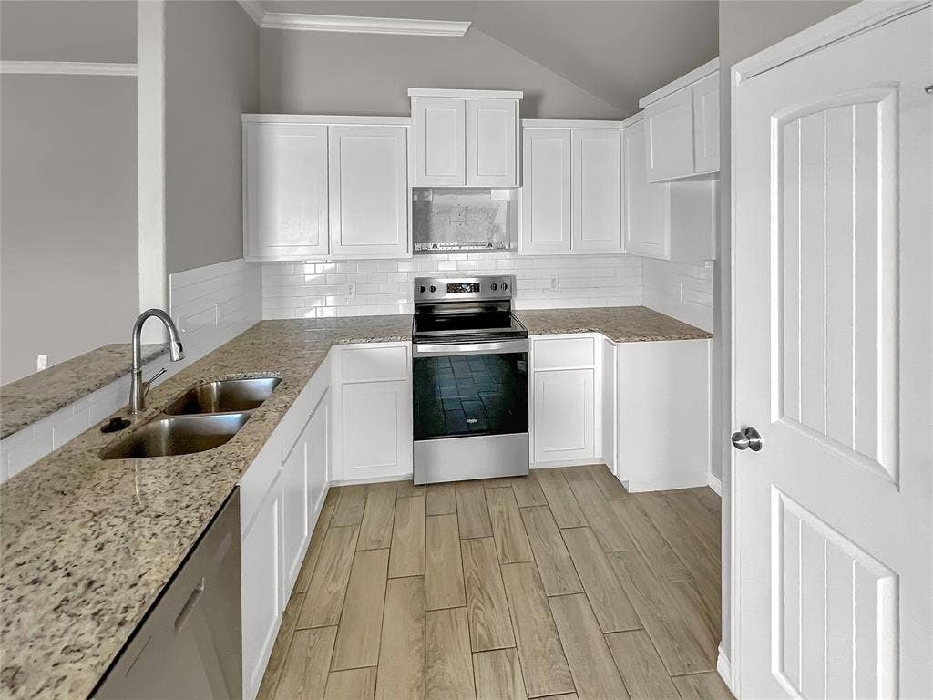 1210 Campbelton Drive, Temple, TX 76504 Kitchen featuring white cabinetry, granite countertops, stainless steel appliances, a subway tile backsplash, and wood-finish flooring