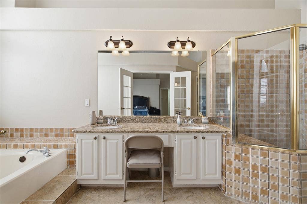 1106 Cain Court, Cedar Hill, TX 75104 Double vanity featuring undermount sinks and a speckled countertop