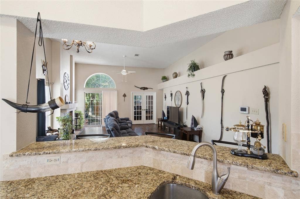 1106 Cain Court, Cedar Hill, TX 75104 Kitchen counter with granite-finish surface and stainless steel sink