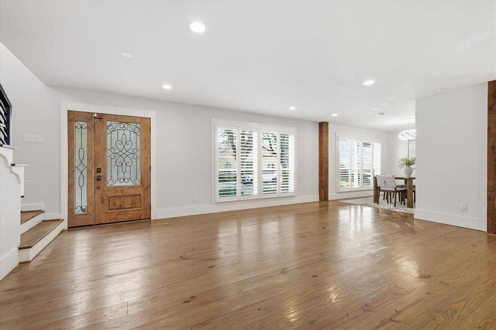 4310 Forest Bend Road, Dallas, TX 75244 Entryway featuring a wood-finish double door with decorative glass inserts, wood-finish flooring, white walls, and recessed lighting