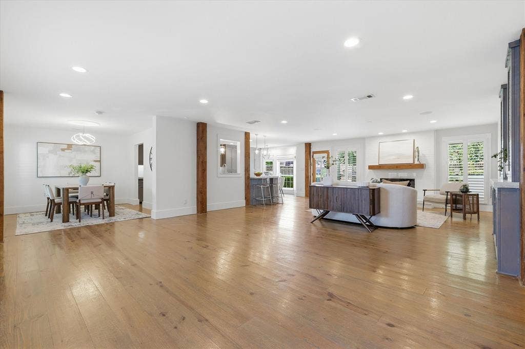 4310 Forest Bend Road, Dallas, TX 75244 Expansive open-concept interior featuring light wood-finish flooring throughout
