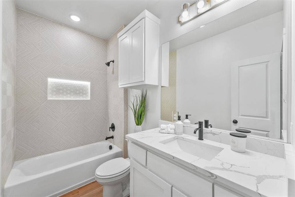 117 Parkside Drive, Trinidad, TX 75163 Bathroom featuring a white vanity with a rectangular undermount sink, a white countertop with grey veining, and a matte black faucet