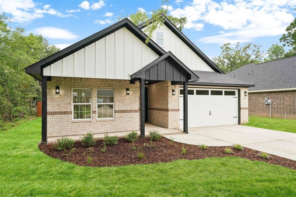 117 Parkside Drive, Trinidad, TX 75163 Contemporary home with light-colored brick and vertical white siding accents
