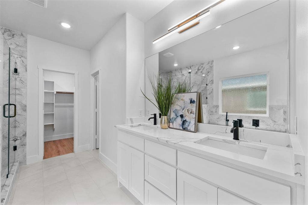 117 Parkside Drive, Trinidad, TX 75163 Bathroom featuring dual vanity with integrated sinks, white cabinetry, and matte black fixtures