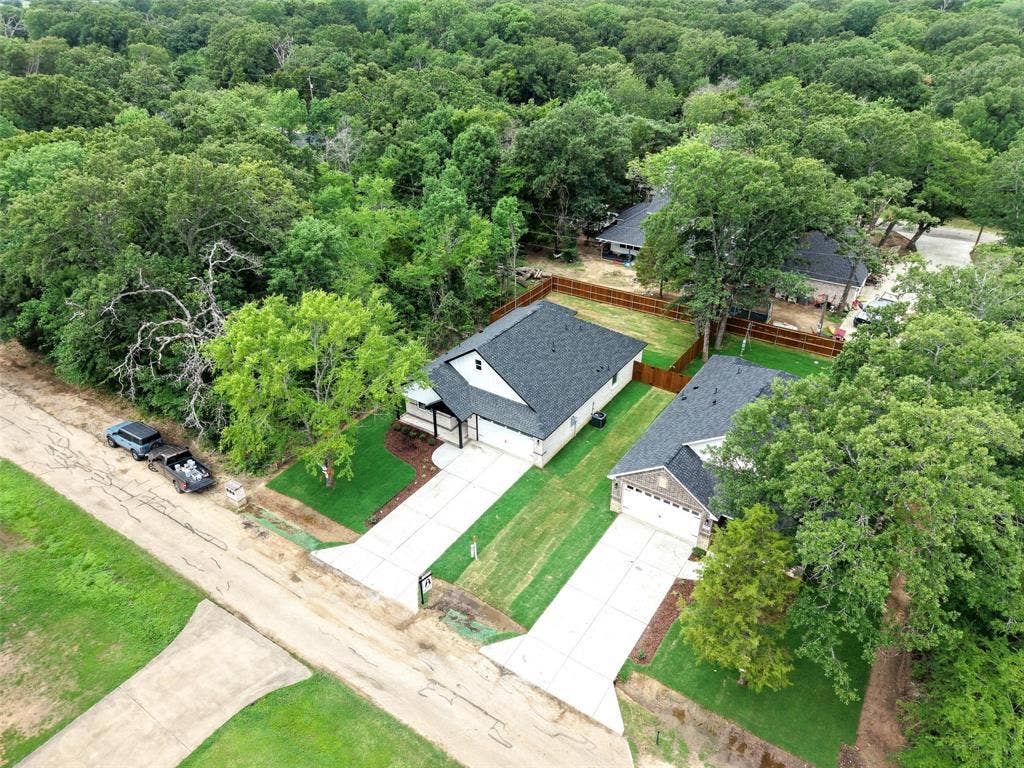 117 Parkside Drive, Trinidad, TX 75163 Newly constructed residence featuring a dark shingle roof and white siding