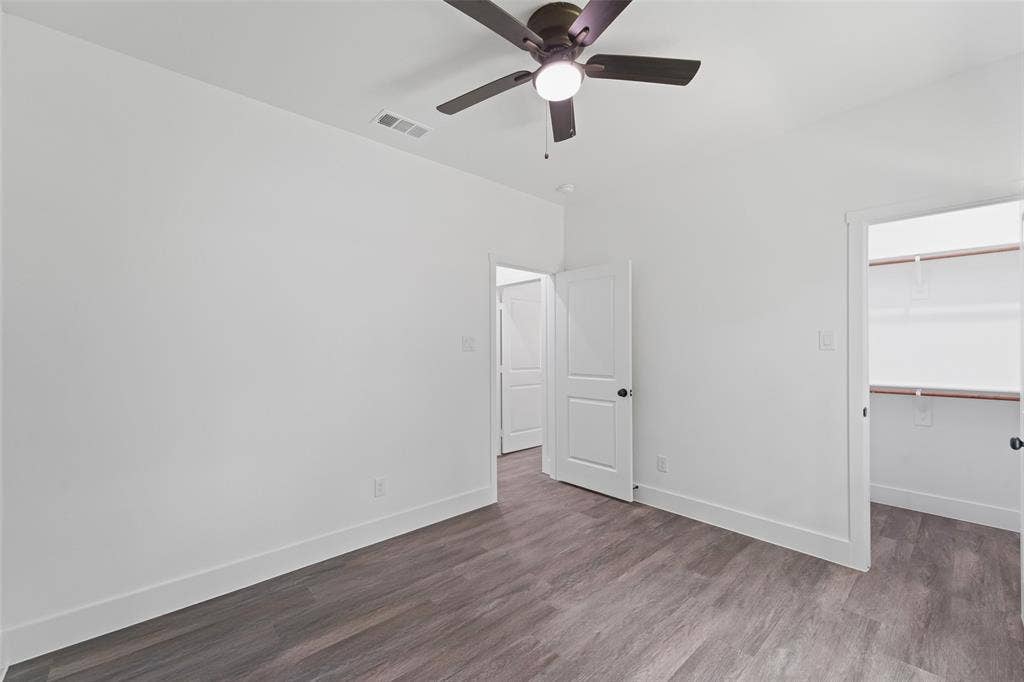 122 E Beachwood Loop, Trinidad, TX 75163 Interior room with wood-finish flooring, white walls, and a ceiling fan
