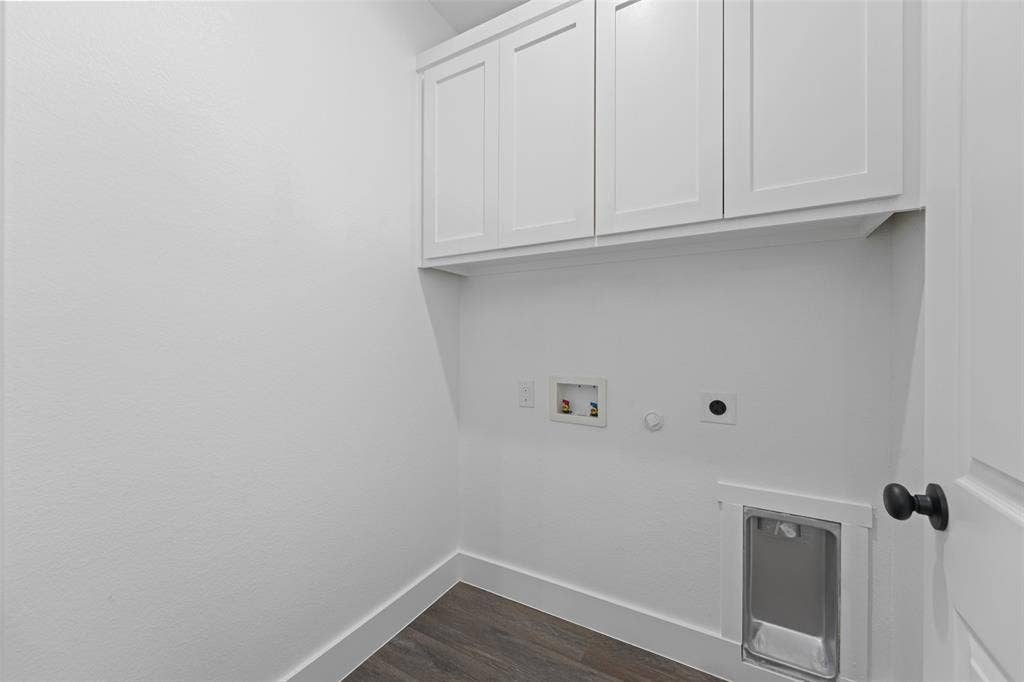 122 E Beachwood Loop, Trinidad, TX 75163 Laundry area featuring wood-finish flooring, white shaker-style cabinetry, and a dedicated utility sink