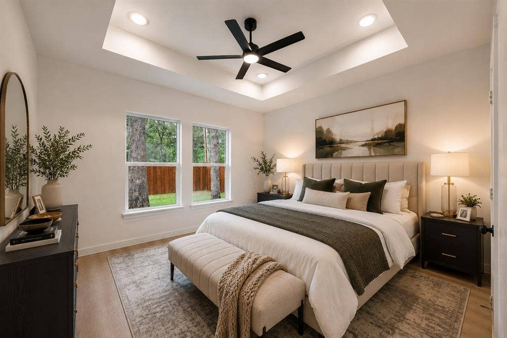 231 E Beachwood Loop, Trinidad, TX 75163 Spacious bedroom featuring light wood-finish flooring, a tray ceiling with recessed lighting, and a contemporary ceiling fan