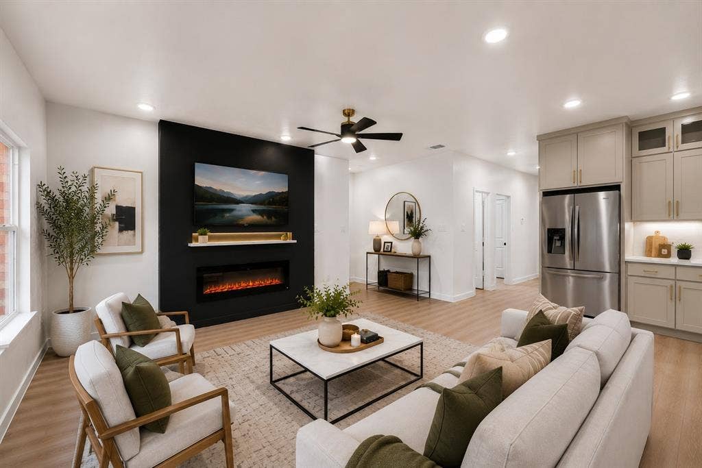 231 E Beachwood Loop, Trinidad, TX 75163 Integrated living space featuring a black accent wall with an electric fireplace, wood-finish flooring, recessed lighting, and a ceiling fan