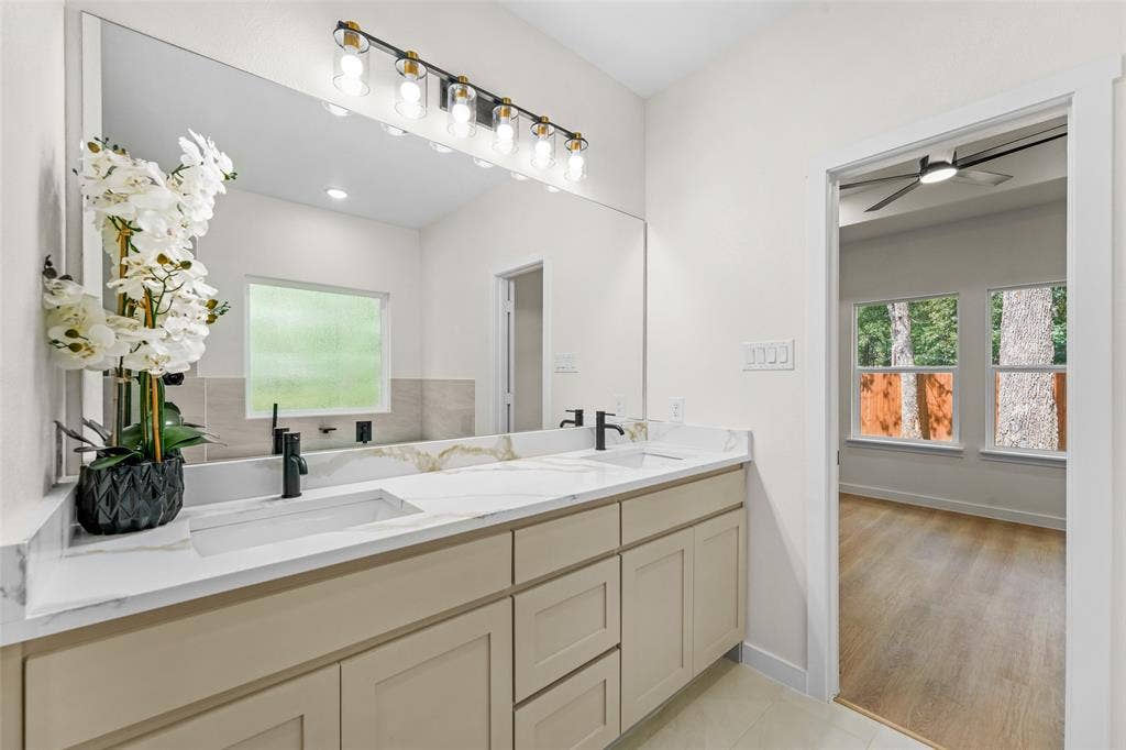 231 E Beachwood Loop, Trinidad, TX 75163 Dual vanity with light cabinetry, white countertops, and integrated rectangular sinks