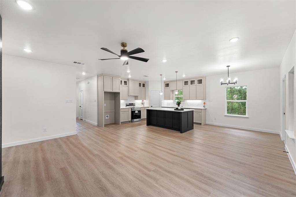 231 E Beachwood Loop, Trinidad, TX 75163 Open-concept living space featuring wood-finish flooring, recessed lighting, and a modern ceiling fan