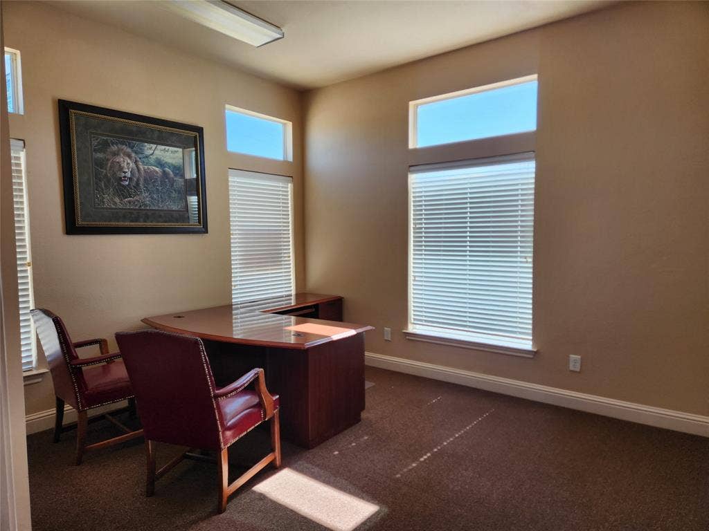 1905 W Ennis Avenue, #301, Ennis, TX 75119 Room featuring neutral-toned walls and contrasting white trim