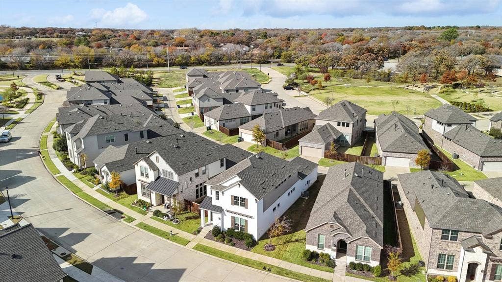 Aerial perspective showcasing a residential street with multiple contemporary homes