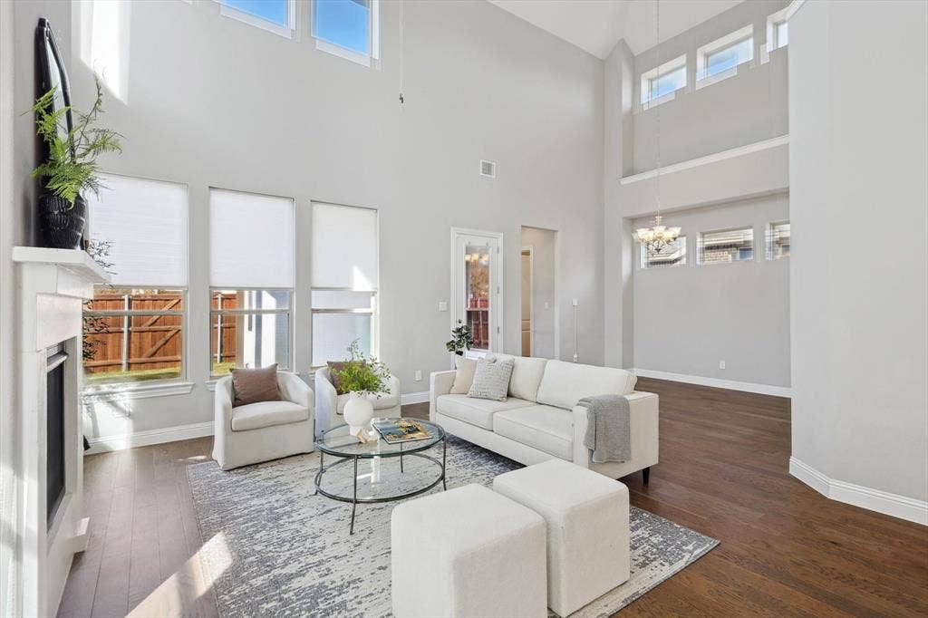 Spacious Living Room with soaring ceilings, wood floors