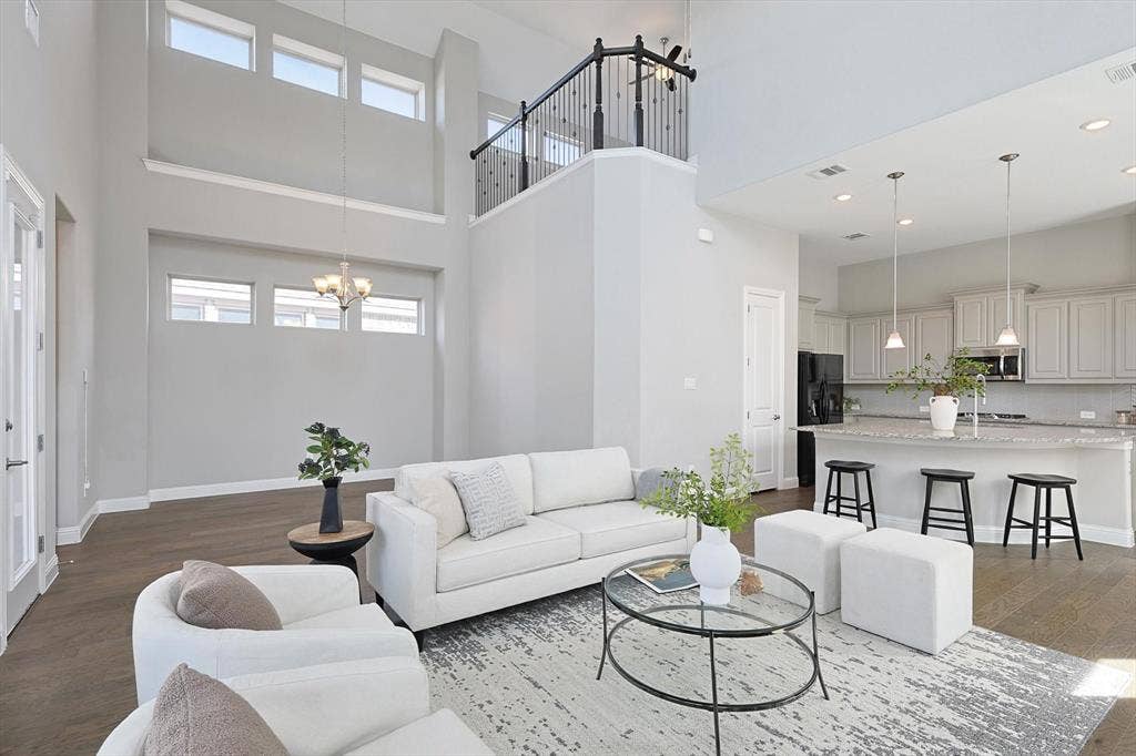 Double-height living space with wood-finish flooring