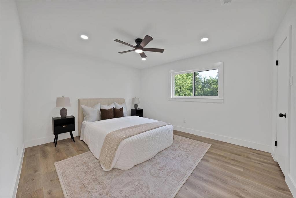 132 Yorkshire Drive, Cedar Hill, TX 75104 Spacious bedroom featuring wood-finish flooring, recessed ceiling lighting, a modern ceiling fan, and a large window with white trim