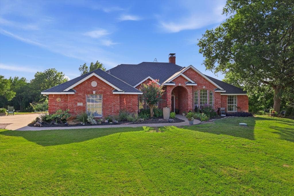 510 Saralvo Road, Midlothian, TX 76065 Brick exterior with dark shingle roofing and white trim accents