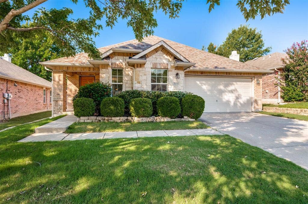 12841 Serenity Drive, Frisco, TX 75035 Stone and brick facade with a gabled roofline