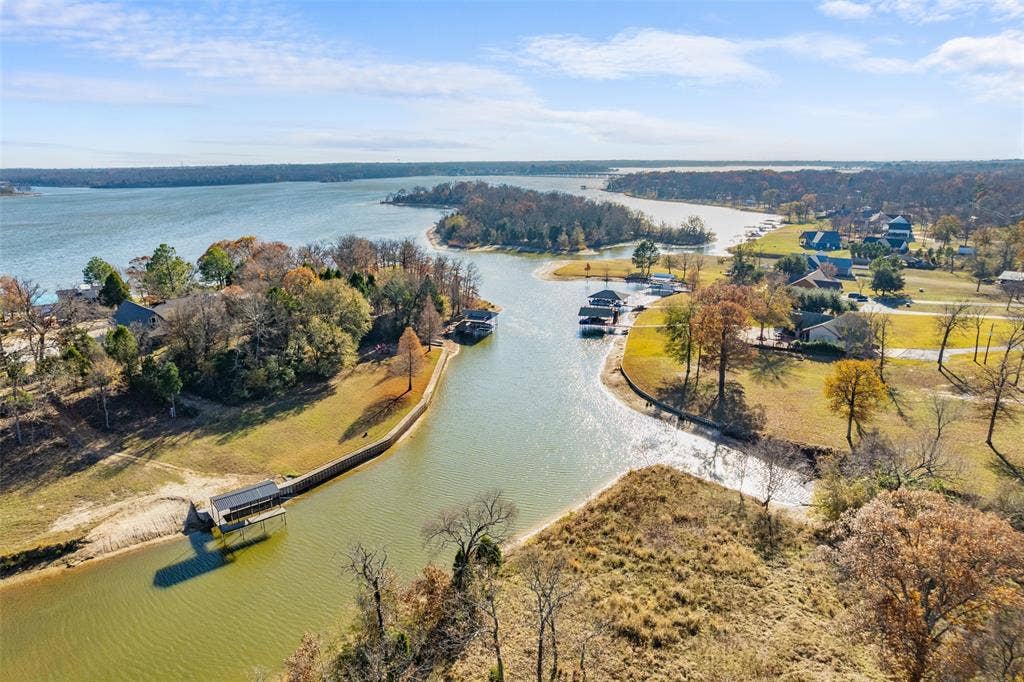 14120 Park Way, Log Cabin, TX 75148 On Peninsula in wide cove on the cusp of open water. Benefits in a cove is it protects your dock and retaining wall from storms that create ocean like waves.