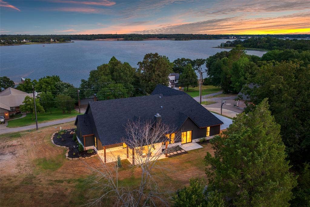 14120 Park Way, Log Cabin, TX 75148 Back of structure. Lake is over the hill with over 400 ft of waterfront on this 1.77 acres.