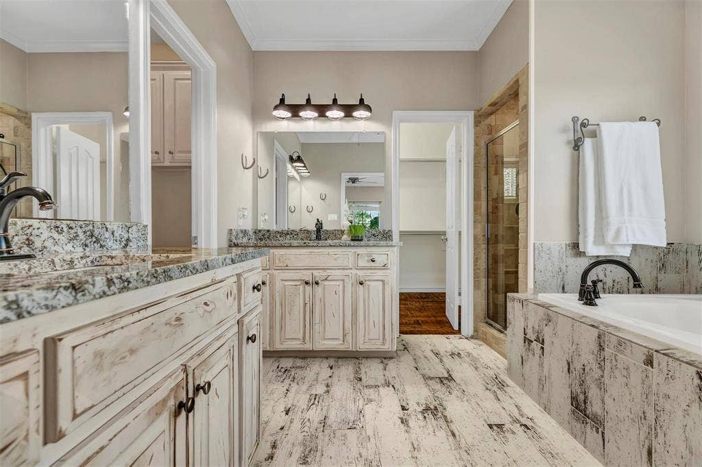 1700 Rock Ridge Road, Lucas, TX 75002 The primary bath is another space the owner is refreshing. See next photo for details.