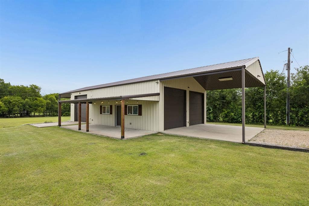 1700 Rock Ridge Road, Lucas, TX 75002 Calling it a workshop, but the possibilities are endless. 1600 sq ft with 3, 12 ft doors, electricity, and climate controlled. Great for car enthusiasts, hobbyists, boat or RV lovers. The exterior porch overlooks the entire acreage