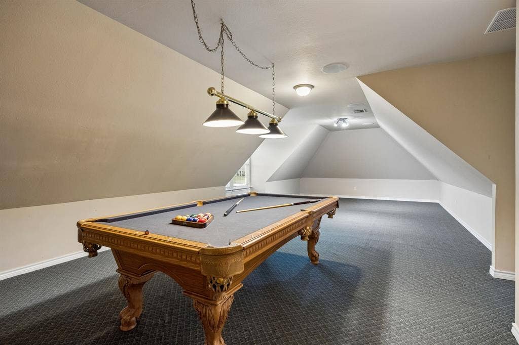 1700 Rock Ridge Road, Lucas, TX 75002 At the end of the hall, over the garage is a spacous rec type space. Pool table fits perfectly and will convey. There is still plenty of room for a big screen. The ultimately game watching fun zone.