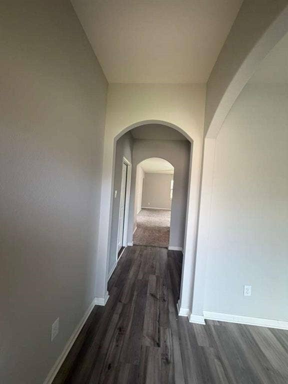310 Foster Lane, Anna, TX 75409 Archway entry featuring wood-finish flooring and neutral wall tones