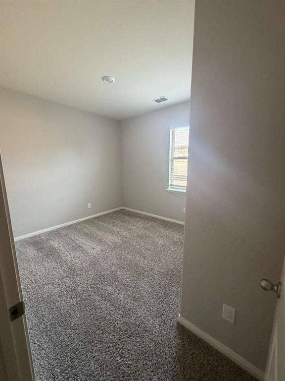 310 Foster Lane, Anna, TX 75409 Spacious room featuring neutral carpeting, light-colored walls, and a window with horizontal blinds