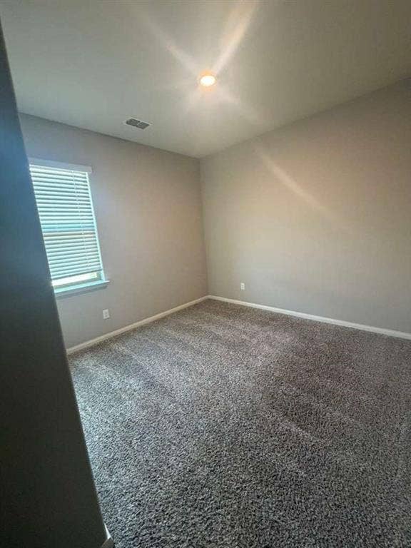 310 Foster Lane, Anna, TX 75409 Carpeted room featuring neutral wall tones, a recessed ceiling light, and a window with blinds
