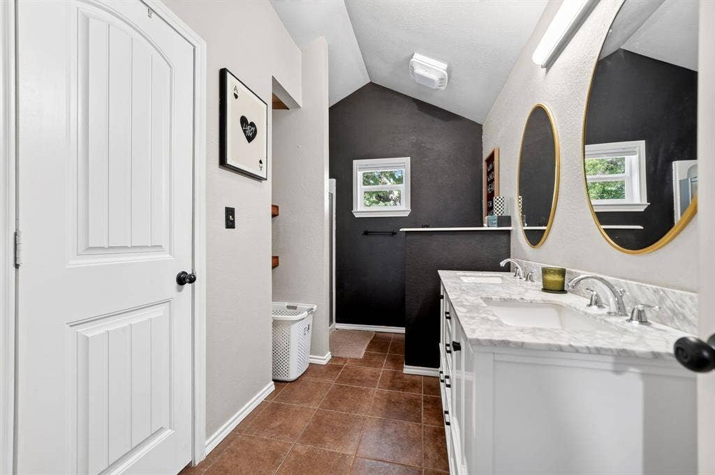 810 Edna Street, Athens, TX 75751 Bathroom featuring a dual vanity with white cabinetry, stone countertops, and undermount sinks