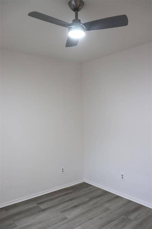 10020 Redondo Drive, Dallas, TX 75218 Brushed nickel ceiling fan with integrated lighting, wood-finish flooring, and crisp white walls