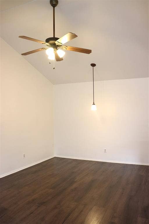 10020 Redondo Drive, Dallas, TX 75218 Vaulted ceiling with a ceiling fan and integrated lighting, wood-finish flooring, and a pendant light fixture