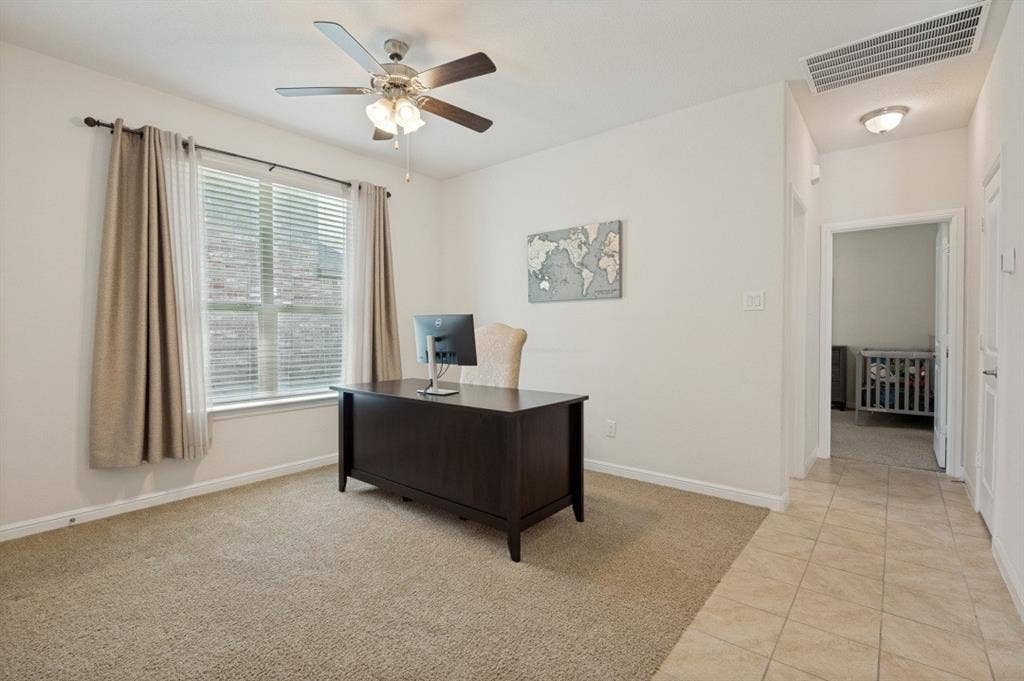 Carpeted room with a ceiling fan, a window with blinds, and white wall paint