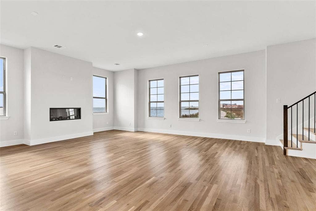 1101 Marc Lane, Rowlett, TX 75088 Built in fireplace, wall of windows viewing lake