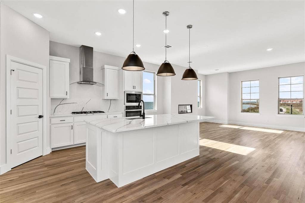 1101 Marc Lane, Rowlett, TX 75088 White quartz countertops, oversized breakfast bar island, gas cooktop, double ovens, walk in pantry