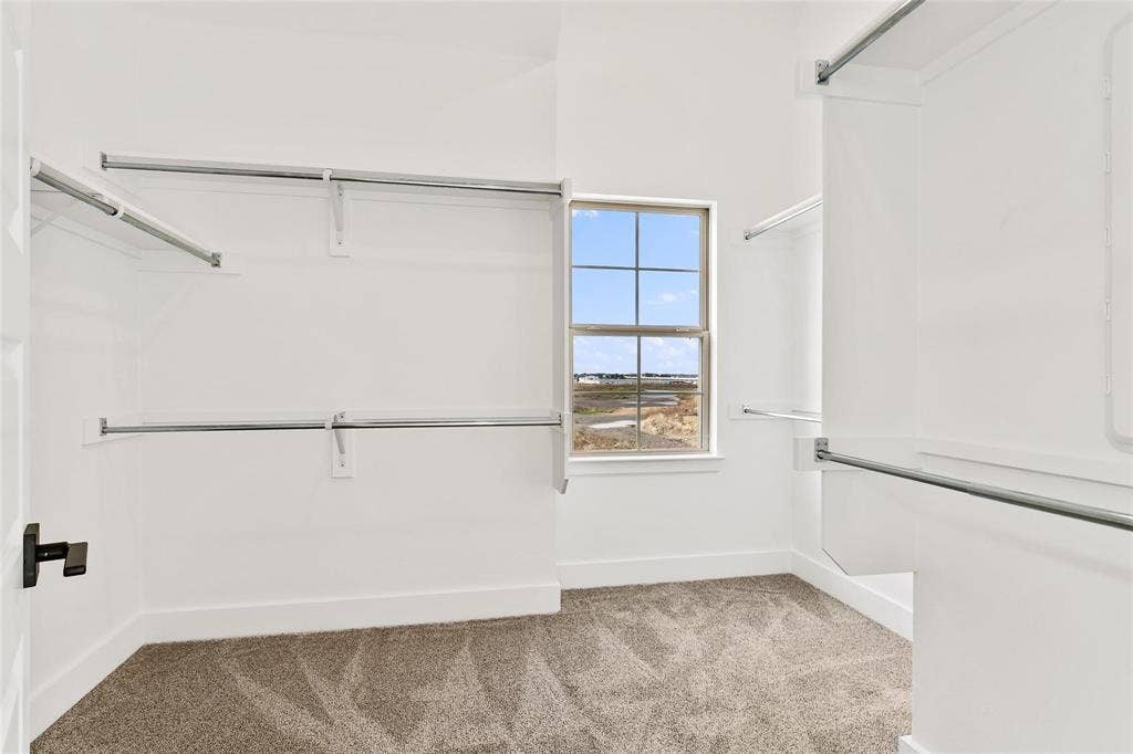 1101 Marc Lane, Rowlett, TX 75088 Large walk in closet with window viewing lake