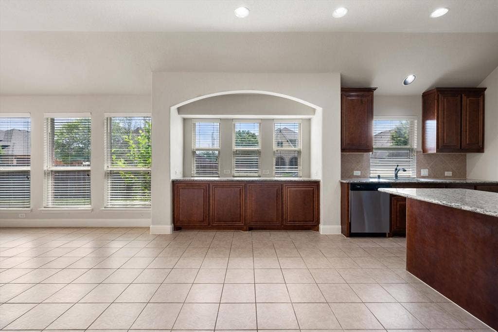 Open-concept living space featuring ceramic tile flooring