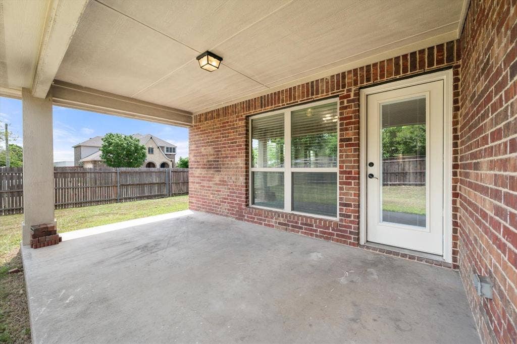 Covered concrete patio perfect for entertaining