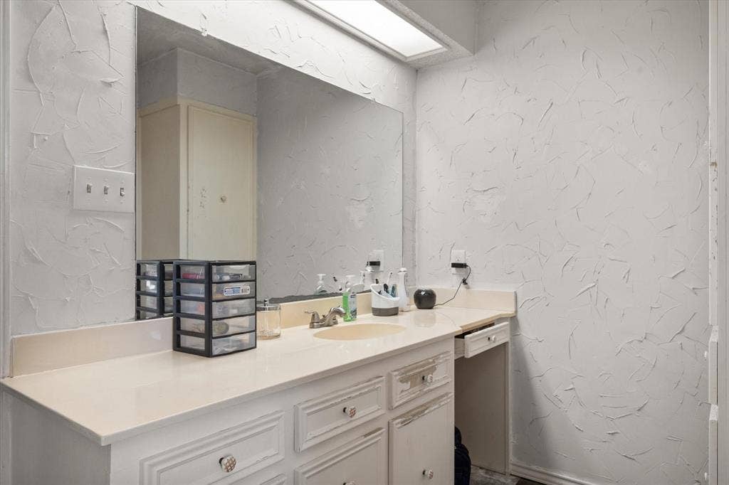 Primary bath has SEPARATE his and her vanities.
