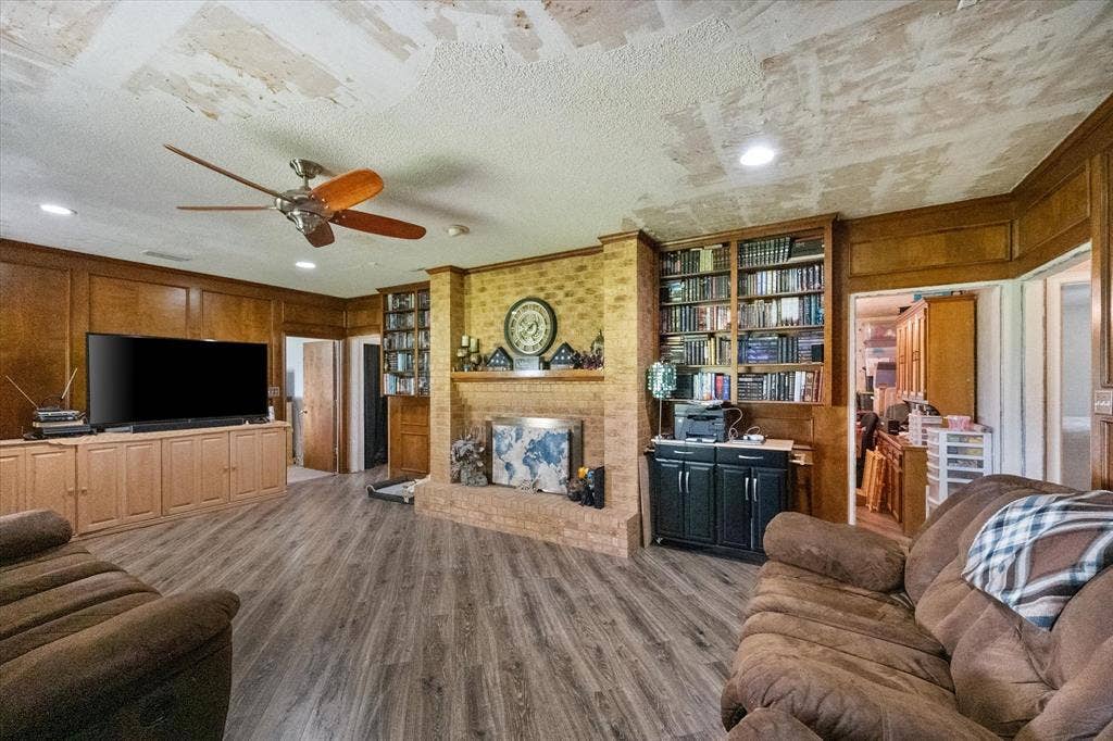 This room is 25'1" x 16'4". Like I said, it's HUGE! Love the built in bookcases too.