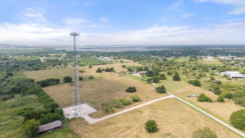 Cell phone tower is under a 40 year lease which began in 2024. The lease is for 75' x75' with an easement to it. The current easment driveway doesn't match the survey exactly, as it was rerouted (it can be moved) to go around the well.