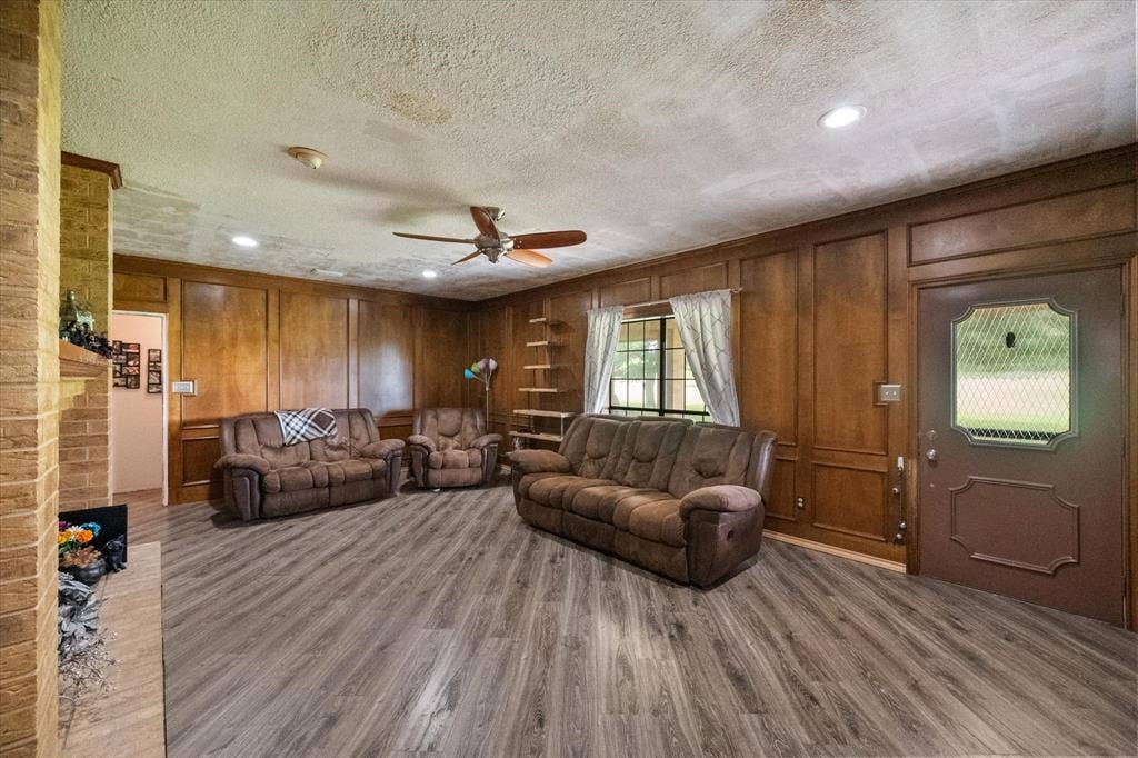 Wood-composite laminate floors. Look like wood but they are water resistent and kid / pet friendly.